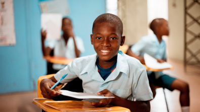 boy holding white paper