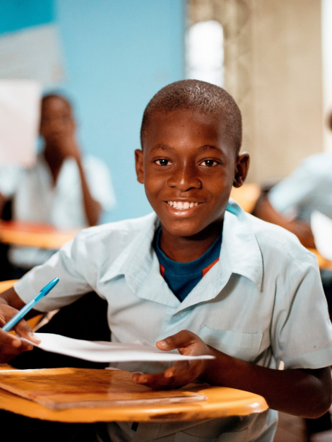boy holding white paper