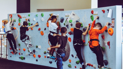 kids on test climb rock